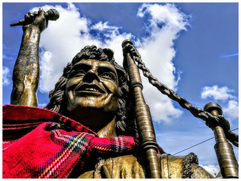 Low angle view of statue against sky