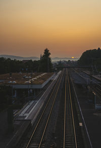 High angle view of railroad tracks against sky during sunset