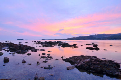 Scenic view of lake against sky during sunset