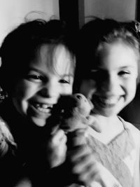 Portrait of mother and daughter at home