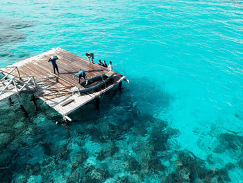 High angle view of people on boat in sea