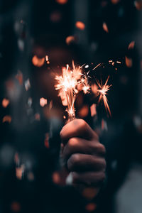 Hand holding firework display