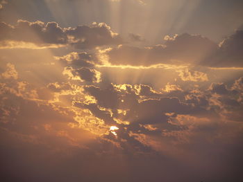 Low angle view of dramatic sky during sunset