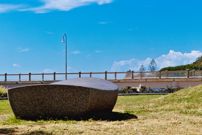 Built structure on field against sky