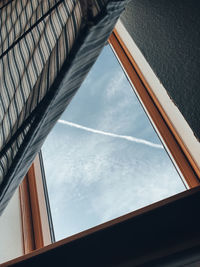 Low angle view of window against sky