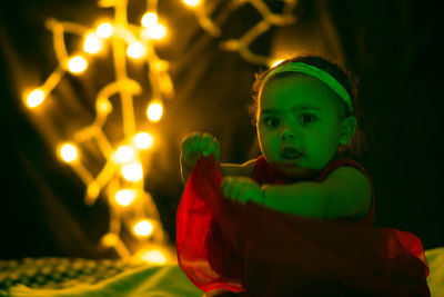 Portrait of girl with illuminated lights