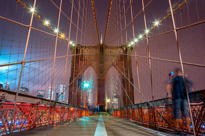 Bridge in city at night