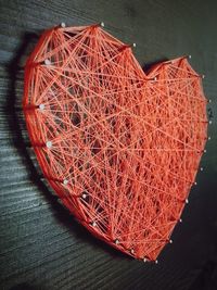 High angle view of illuminated heart shape on table