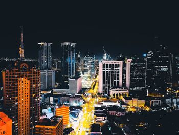 High angle view of illuminated buildings in city at night