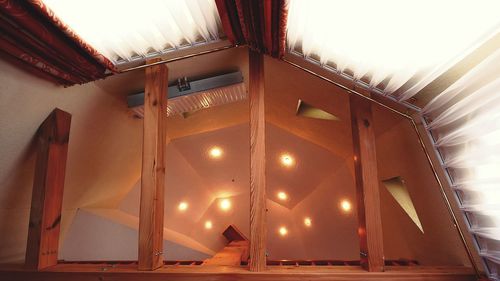 Low angle view of illuminated ceiling