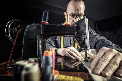 Man using sewing machine