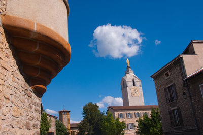 Low angle view of building against blue sky