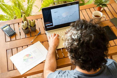 High angle view of man using laptop