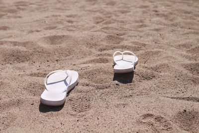 High angle view of shoes on beach