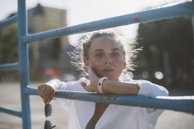 Portrait of girl on railing