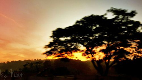 Scenic view of landscape at sunset