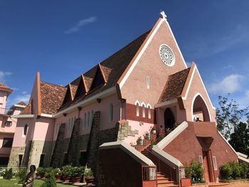 Low angle view of building against blue sky