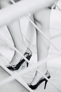 Low section of woman in high heels