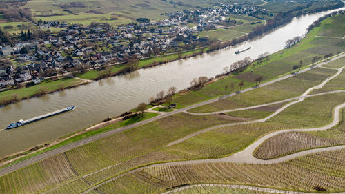 Aerial view of the river moselle valley with cargo ship and the village brauneberg