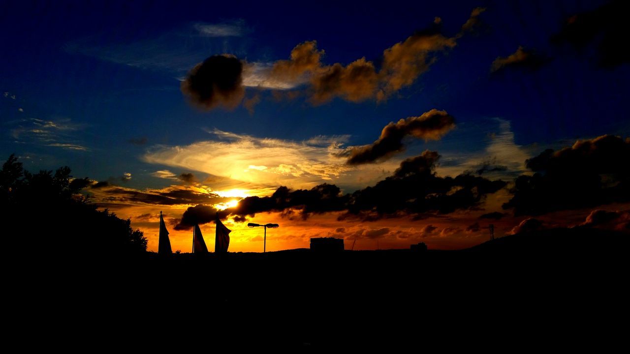 silhouette, sunset, sky, scenics, beauty in nature, tranquil scene, tranquility, nature, dark, built structure, landscape, outline, cloud - sky, dusk, tree, idyllic, building exterior, architecture, orange color, cloud