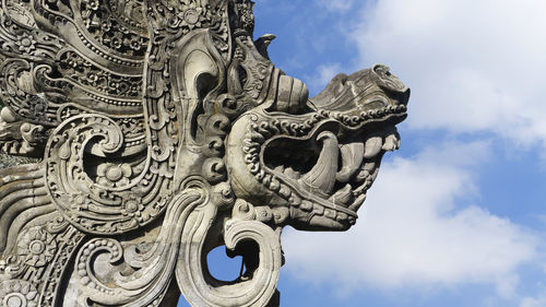 Low angle view of statue against sky