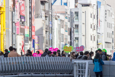 Crowd on street in city