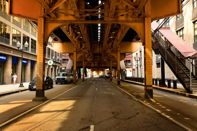 A road under chicago's elevated railway, more commonly known as the l.
