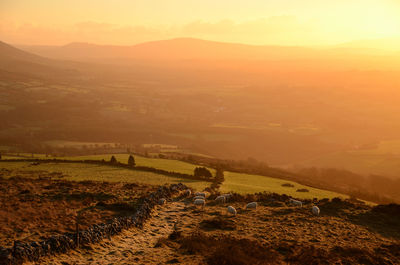 Scenic view of landscape against sky during sunset