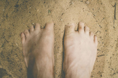 Low section of person on sand