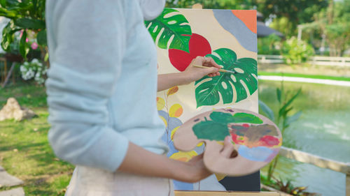 Midsection of woman holding christmas presents