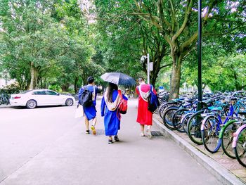 Woman walking on footpath