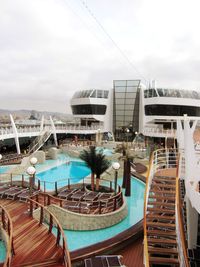 Boats in swimming pool against sky