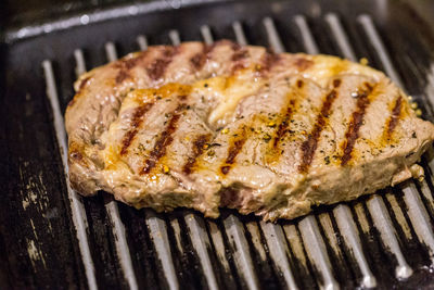 Close-up of meat on barbecue grill