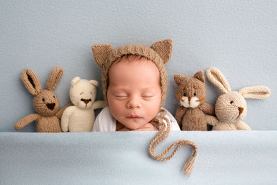 Portrait of cute baby boy with teddy bear