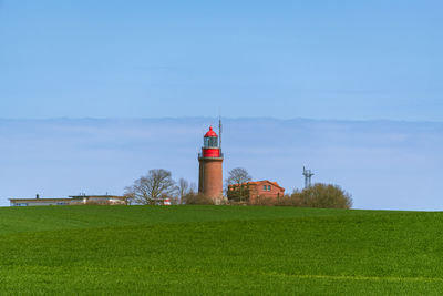 Scenic view of field against clear blue sky