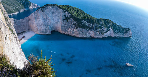 High angle view of rocks on sea shore