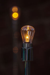 Close-up of illuminated light bulb