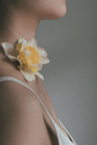 Close-up of woman holding flowering plant