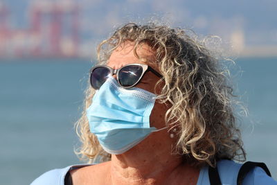 Close-up portrait of woman wearing sunglasses