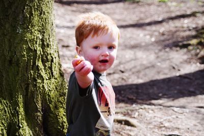 Easter egg hunt in woods with toddler
