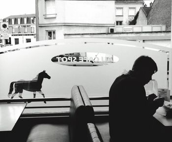 Woman standing in front of building