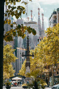 Statue against trees in city