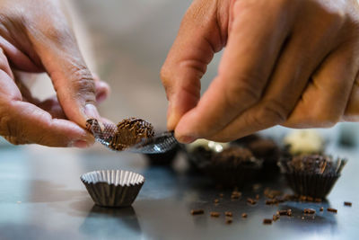 Close-up of man preparing food