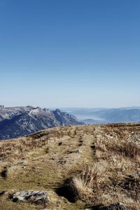 Scenic view of landscape against clear blue sky