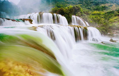 View of waterfall in forest