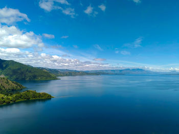 Scenic view of sea against blue sky