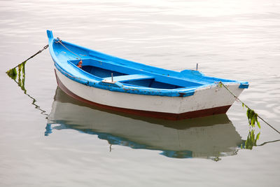 High angle view of boat moored in lake