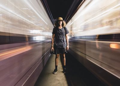 Blurred motion of woman in tunnel