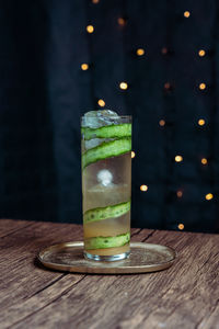 Zero proof cocktail with cucumber garnish