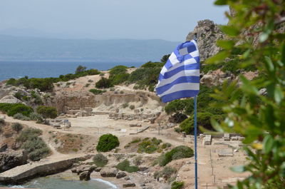 Scenic view of mountains against blue sky